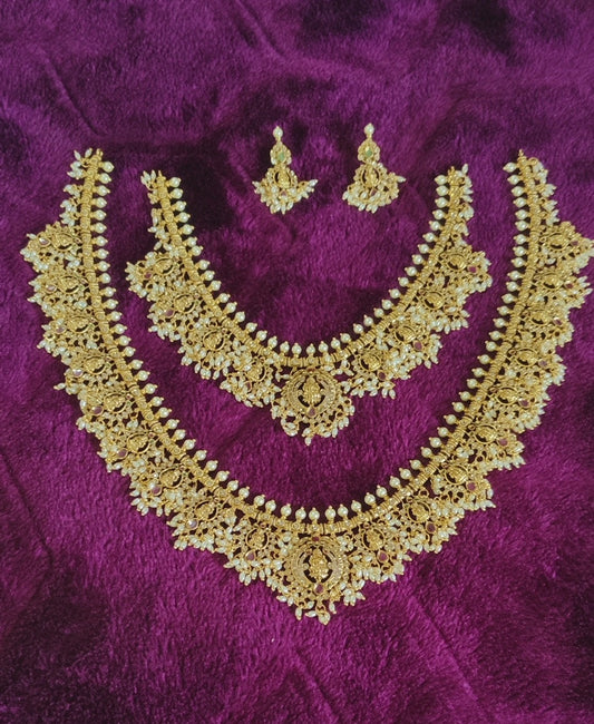 GRAND BRIDAL SET WITH LAKSHMI DEVI MOTIFS WITH PEARLS AND RICE BEADS