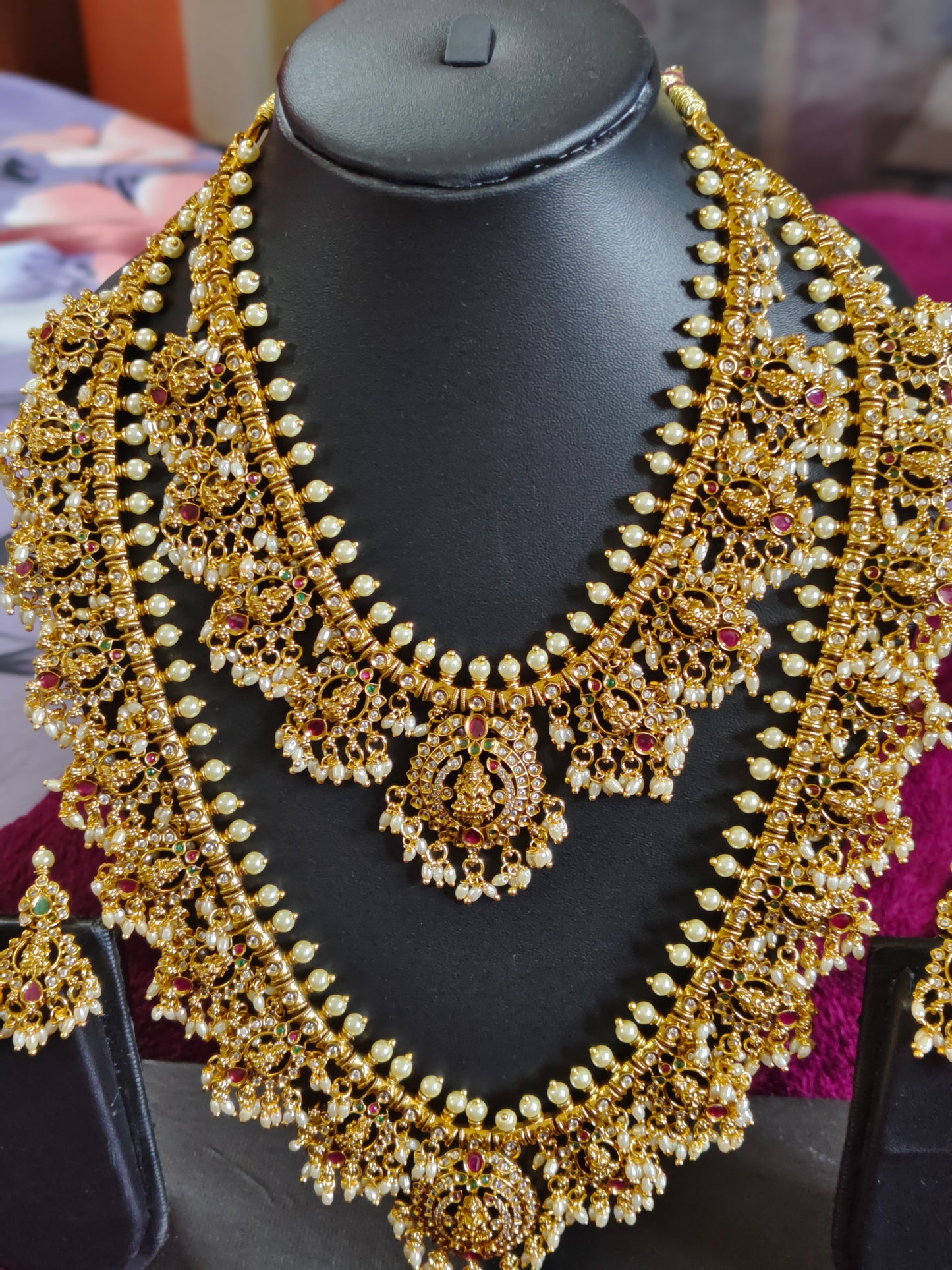 GRAND BRIDAL SET WITH LAKSHMI DEVI MOTIFS WITH PEARLS AND RICE BEADS