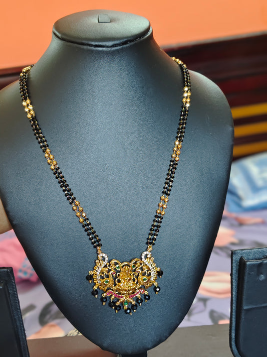 LONG BLACK BEADS CHAIN WITH LAKSHMI DEVI IN THE CENTRE PEACOCKS ON BOTH SIDES