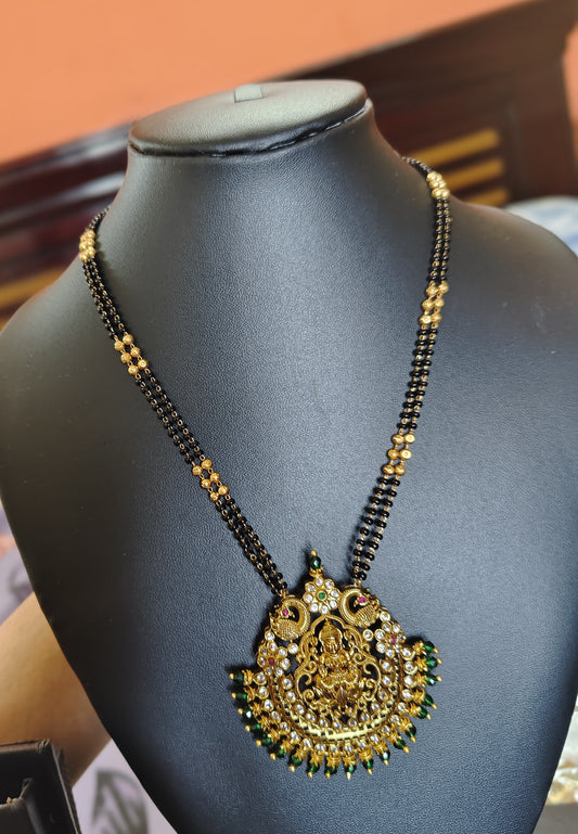 LONG BLACK BEADS CHAIN WITH LAKSHMI DEVI AND GREEN BEADS DOLLAR
