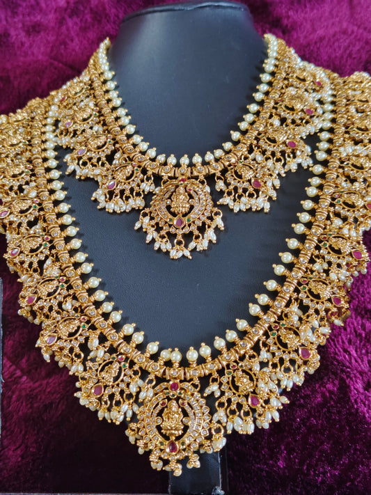 GRAND BRIDAL SET WITH LAKSHMI DEVI MOTIFS WITH PEARLS AND RICE BEADS