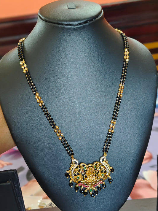 LONG BLACK BEADS CHAIN WITH LAKSHMI DEVI IN THE CENTRE PEACOCKS ON BOTH SIDES