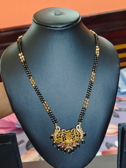 LONG BLACK BEADS CHAIN WITH LAKSHMI DEVI IN THE CENTRE PEACOCKS ON BOTH SIDES