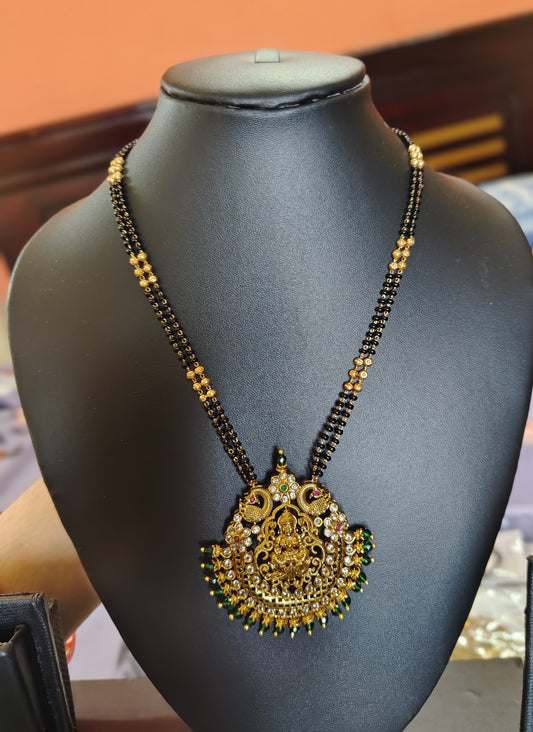 LONG BLACK BEADS CHAIN WITH LAKSHMI DEVI AND GREEN BEADS DOLLAR